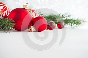 Red xmas ornaments on wooden background. Merry christmas card.