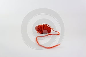 Red yarn with curl isolated on white background