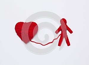 Red yarn heart and human figure