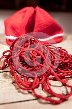 Red yarn, woolen string and beanie, knitting and crochet