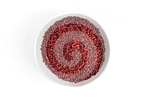 Red yeast fermented rice or kojic rice on white plate