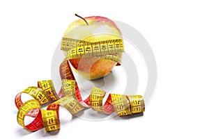 Red-yellow Apple with a measuring tape