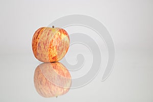 Red and yellow apple, white background