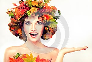 Red and yellow autumn Leaves on girl head.