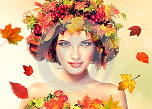 Red and yellow autumn Leaves on girl head.