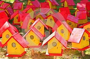 Red and yellow bird houses