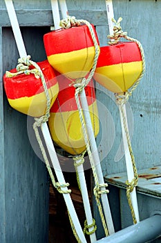 Red and Yellow buoys from weathered dock