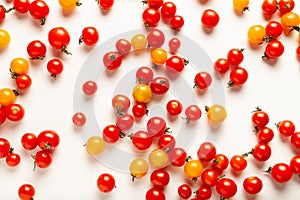 Red and yellow cherry tomatoes isolated on white background. Fresh bright organic vegetables