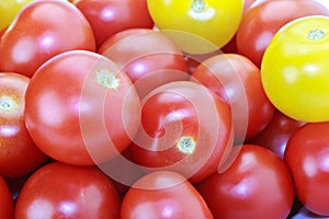 Red and yellow cocktail tomatoes isolated on white