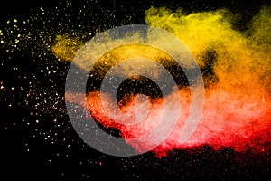 Red yellow color dust particle splattered on background.