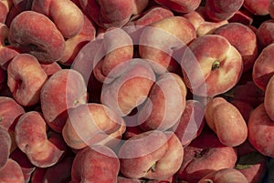 Red and Yellow Donut Peaches in a Box