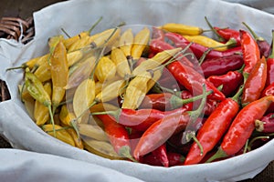 Red and Yellow Dried Chili Peppers inside White Bowl
