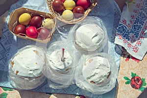 Red yellow easter eggs, Ester cakes with white powdering covering photo