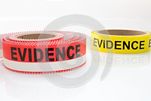 Red and yellow evidence tape on white background