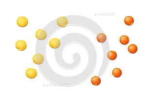 Red and yellow football lentils isolated on white background. Top view