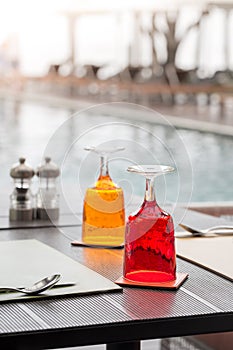 Red and Yellow Glass of water on luxury table setting