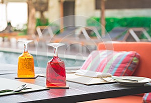 Red and Yellow Glass of water on luxury table setting