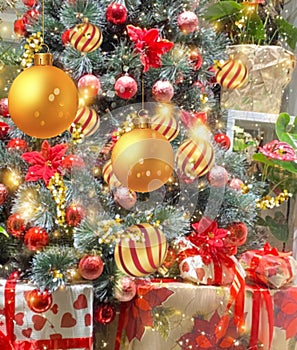 Red yellow gold  christmas ball gold confetti and green tree with festive decoration on window vitrine  reflection holiday backgro
