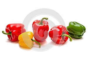 Red, yellow and green paprika on a white background