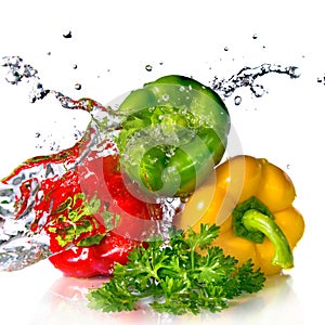 Red, yellow, green pepper and parsley with water