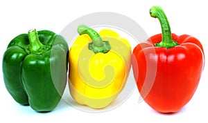 Red, yellow and green peppers, traffic light colours isolated on white background