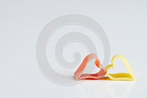 Red an yellow heartshaped noodle - rote und gelbe herzfoermige Nu photo