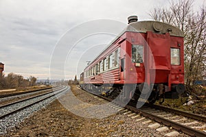 Red-yellow locomotive train on the tracks