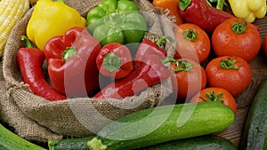 red yellow orange bell peppers on a wooden cutting board. table top