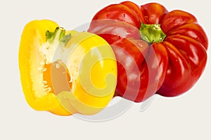 Red, yellow, orange, l peppers on white background