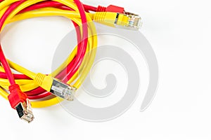 Red and yellow patch cables with RJ45 connector isolated on whit