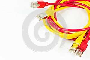 Red and yellow patch cables with RJ45 connector isolated on whit