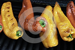 Red and yellow peppers on the barbeque