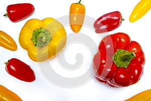 Red and yellow peppers on white