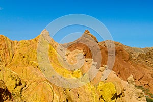 Red and yellow rock castle shaped mountains and rock formation valley