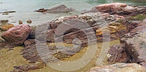 Red and Yellow Sandstones on Beach