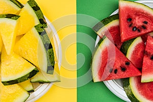Red and Yellow Seedless Watermelon Sliced on Plates,Pastel Background,Flat Lay
