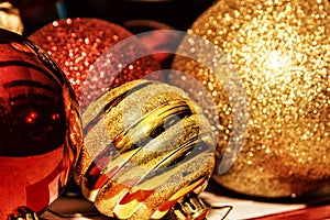 Red and yellow shimmering christmas baubles, retro photo filter