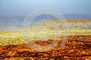 Red and yellow sulphur fields, volcanic landscape  Danakil Depression desert, Afar region, Ethiopia photo