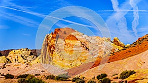 The red, yellow and white sandstone rock formations along the White Dome Road in the Valley of Fire State Park in Nevada,