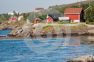 Red and yellow wooden fishing cabins in Norway