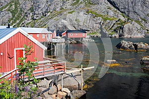 Red and yellow wooden fishing cabins in Norway