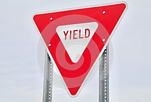 Red Yield Sign Against the Sky