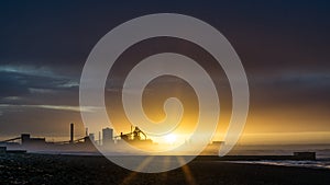 Redcar beach at sunset. Industrial background.