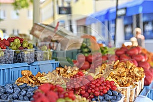 Redcurrants, raspberries, gooseberries, billberries, and other fruit and vegetables for sale at local farmers market