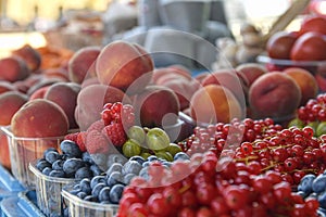 Redcurrants, raspberries, gooseberries, billberries, peaches and other fruit and vegetables for sale at local farmers