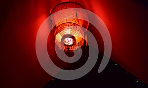 Reddish Chinese lamp with red background