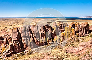 Reddish rock formations in Aramu Muru near Puno, Peru