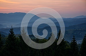 Reddish sky at dawn in mountains