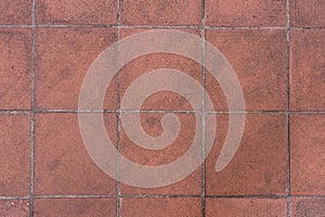 Reddish stone tile on pavement outdoor