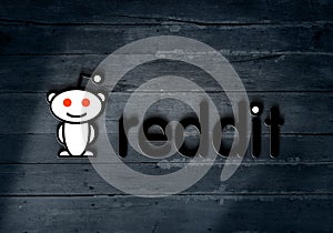 Reddit social media logo on dark